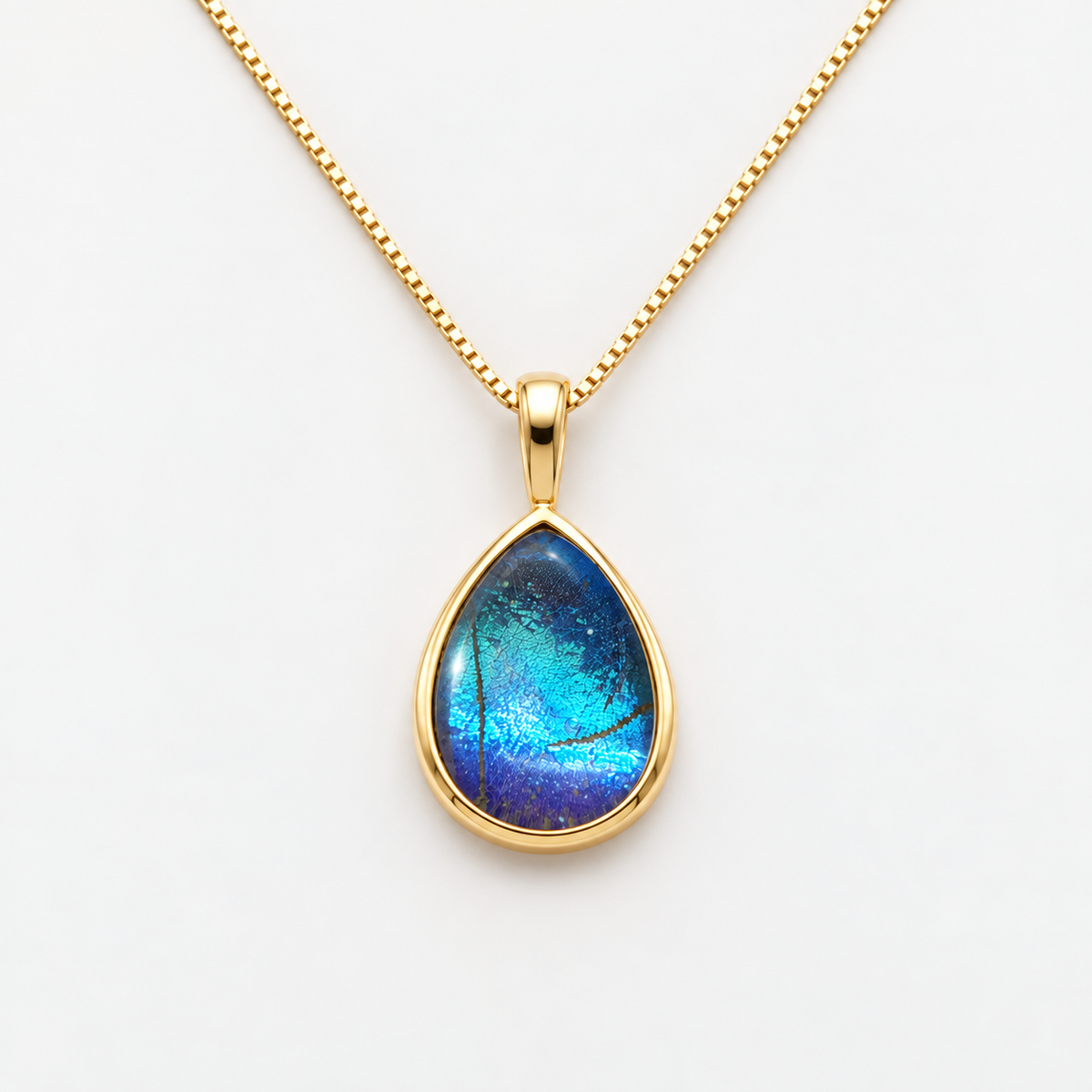 Iridescent Blue Cabochon Charm – Gold Plated