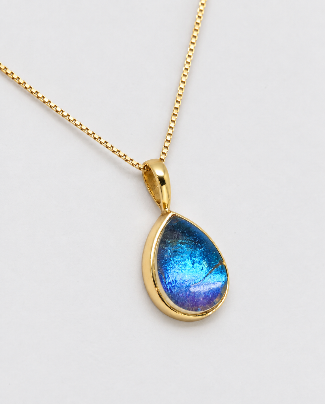 Iridescent Blue Cabochon Charm – Gold Plated